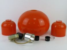 A c970s layered glass ceiling pendant with pair of table lamp shades in orange and white,