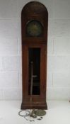 A mahogany cased Grandmother clock having brass dial, a/f one weight and part of movement in base,
