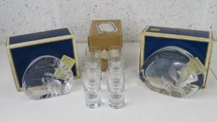 Two Mats Johnasson Swedish glass paperweights in original boxes being hermit crab and badger.