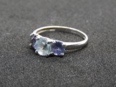 A 9ct white gold Aquamarine and iolite trilogy ring, hallmarked 375, size P, 2.1g.