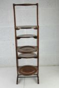 A five sectional folding mahogany lazy susan c1930s, 90cm high.