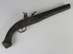 An antique pistol cocks and fires but a/f, probably Indian, total length approx 43cm.