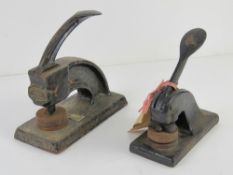 Two vintage cast iron stamps, one for Lewis Coates and Lupus Ltd,