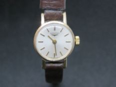 A 9ct gold ladies Longines wristwatch having silvered dial, dial,