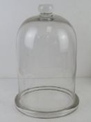 A large glass cloche standing 37cm high, 25cm dia.
