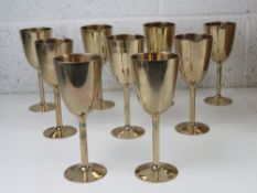 A set of contemporary brass goblets, each standing 18.5cm high.