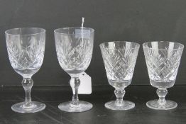 A pair of Thomas Webb lead crystal wine glasses together with a pair of short lead crystal wine