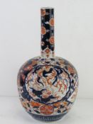 A large vase in reds and blues having floral Chinese decoration upon, all standing approx 37cm high.
