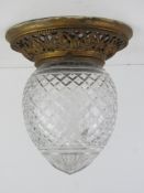 A cut glass and brass ceiling light fitting approx 21cm dia at widest x 23cm high.