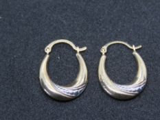 A pair of 9ct gold hoop earrings, stamped 375.