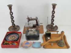 A pair of carved wooden candlesticks together with crumb tray brush, two enamel copper pin trays,