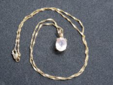 A rose quartz pendant on 9ct gold fancy link chain, pendant stamped indistinctly, chain stamped 375,