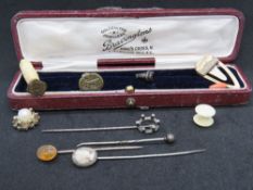 A yellow metal stock pin together with a cameo stock pin and various other items including bone