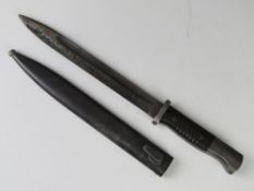 A WWII German K98 bayonet, blade marked 42 cof (Karl Eickhorn), with serial number 3290J.