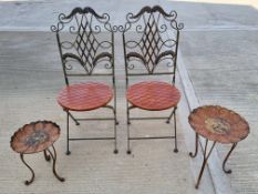 A pair of garden bistro chairs with pair of graduated sunflower tables.