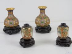A pair of Canton enamelled cloisonné short vases with Oriental hardwood stands, vases standing 9.