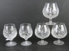 A pair of Stuart Crystal brandy balloons together with a set of three other lead crystal brandy
