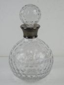 A cut glass decanter having HM silver collar marked for Birmingham.