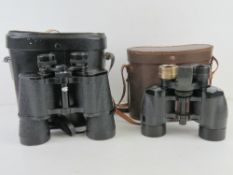 Two pairs of binoculars in cases, one marked for Ross of London in pigskin leather case,