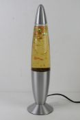 A contemporary glitter lava lamp, untested for rewiring.