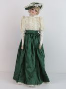 A handmade 20th century bisque headed doll made using an antique doll mould,