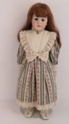 A handmade 20th century bisque headed doll made using an antique doll mould,