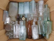 A quantity of vintage glass bottles inc poison bottles, Paterson's bottles,