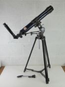 A Bresser telescope with stand.