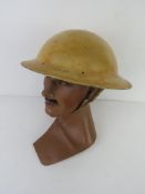 A rare WWII South African Brodie helmet with three sunshade holes.