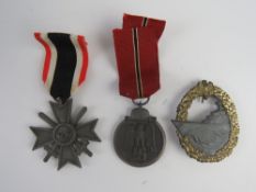 Three WWII German medals awarded to the same individual.