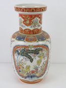 A contemporary Chinese influence vase in white ground with blue and orage decoration and Fo dogs