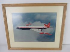 Photographic print; Royal Aircraft Establishment aircraft in flight, sight size 39 x 27.