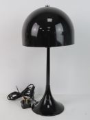 A retro 1970's style table lamp with shade.