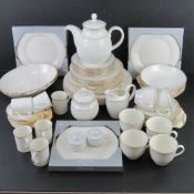 A contemporary white ground tea, coffee and dinner service for six, oven and dishwasher safe.
