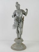 An aluminium figure of a knight with brass sword and dagger, slightly a/f 40cm high.