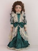A handmade 20th century bisque headed doll made using an antique doll mould,