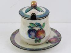 A Carlton Ware lustre preserve or jam pot with lid and drip tray, Rd No 725809.