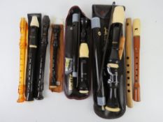A quantity of vintage recorders, various sizes including four by Aulos and a Yamaha.