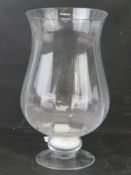 A hand made glass vase 30cm high.