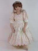 A handmade 20th century bisque headed doll made using an antique doll mould,