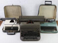 Three vintage typewriters inc Remington Rand, Olivetti and Lilliput.