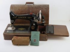 A Singer sewing machine with original lid and key, Y7652147.