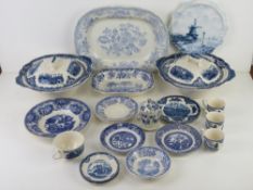 Blue and white ceramics including tea strainer, coffee cups,