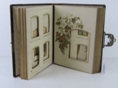 A leather bound and gilded late 19thC / early 20thC photograph album.