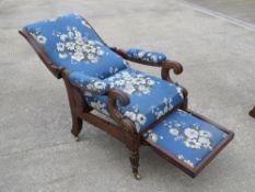 A Victorian mahogany reclining chair with pull out footrest,