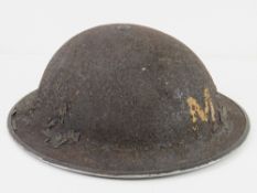 A WWII helmet in original unrestored condition.