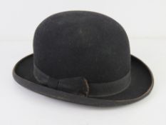 A felt bowler hat as made by Herbert Johnson of London, size 7 1/4.