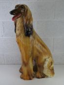 A life size ceramic figurine of an Afghan Hound, Italian made, sitting 82cm high.