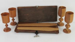 A pair of Twigs of New Zealand carved cups together with another pair similar and an early 20thC