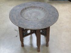 A late 19thC / early 20thC Arabic brass top table,